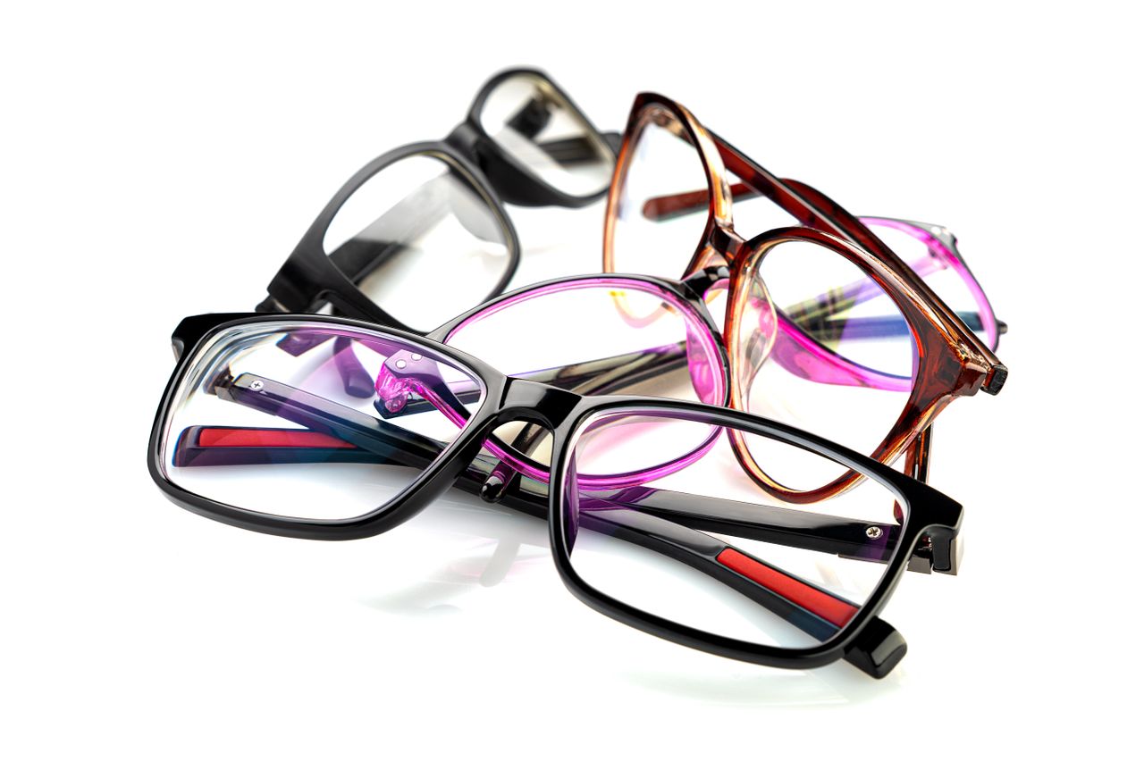 A vibrant collection of eyeglasses arranged on a white background.